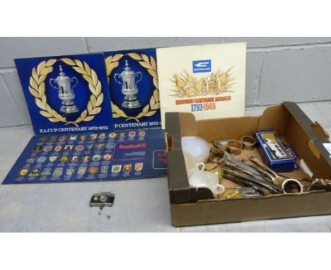 Assorted items; commemorative coins, six cups and saucers, table lighters, plated vase, model vehicles and a small 'Oriental'