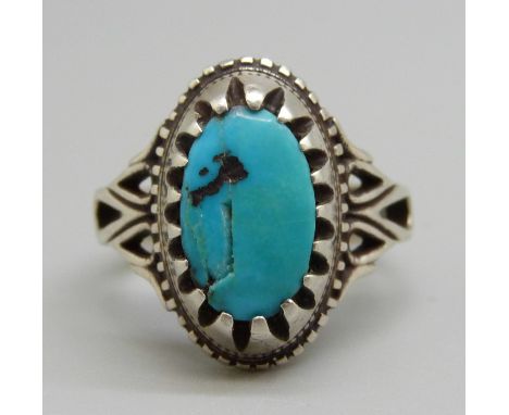 A native American style silver and turquoise ring, T 