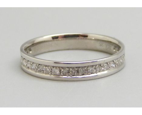 An 18ct white gold three quarter diamond eternity ring, N, 2.3g, 25 diamonds, 0.25ct total diamond weight marked on the shank
