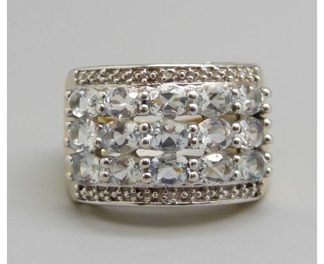 A silver gilt white stone ring, L 