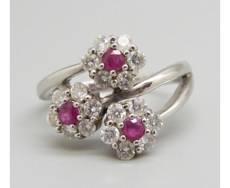 A large 14ct white gold, diamond and ruby triple cluster ring, 4.4g, V 