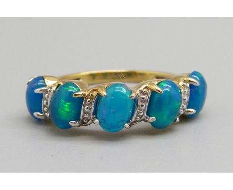 A silver gilt five stone synthetic blue opal ring, N 