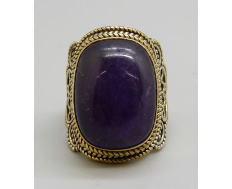 A silver gilt blue stone ring, L 