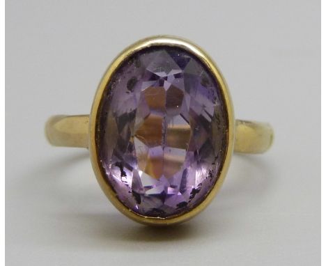 A silver gilt amethyst solitaire ring, L 