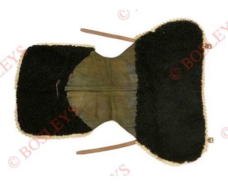 Edwardian Cavalry Trooper’s Saddle Rug. A good and rare example for a regiment with white facings. Black lambskin, with scall