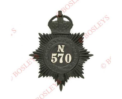 Badge. N (Islington) Division, Metropolitan Police pre 1935 helmet plate. Scarce die-stamped re-blackened crowned star with a
