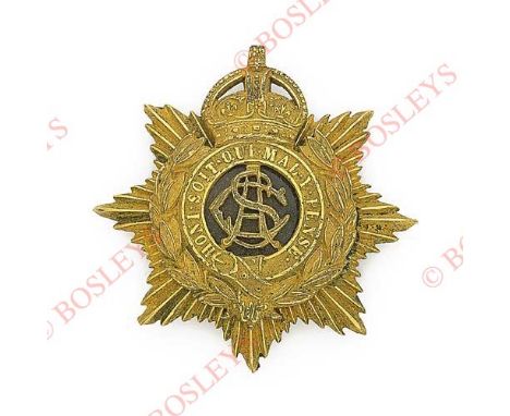 Badge. Army Service Corps Officer’s pouch badge circa 1902-18. A good die-stamped gilt metal star mounted with crowned garter
