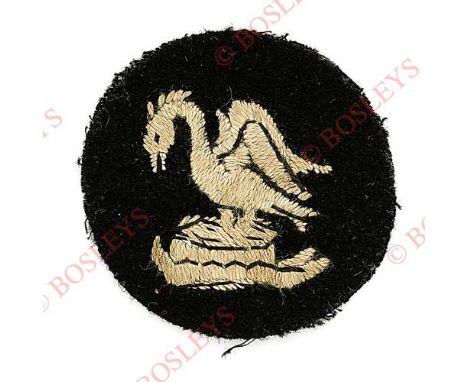 Badge. 30th Division WW1 cloth formation sign. White crest of Lord Derby embroidered on black disc. VGC New Army division of 