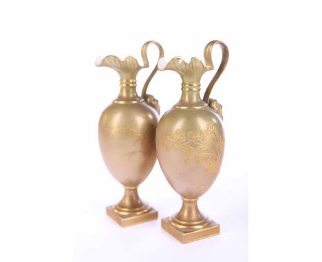 PAIR OF ROYAL WORCESTER PORCELAIN PEDESTAL EWERS
each with wavy rim and moulded satyr mask to handle, shape number 1144, purp