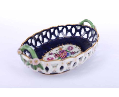 EDWARDIAN ROYAL WORCESTER OVAL BASKET
dated 1909, lattice work to body encrusted with flowers, royal blue interior with hand-