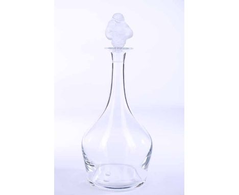 CONTEMPORARY LALIQUE CLEAR GLASS DECANTER
of tapering bulbous form, the frosted glass stopper modelled as two entwined nude f