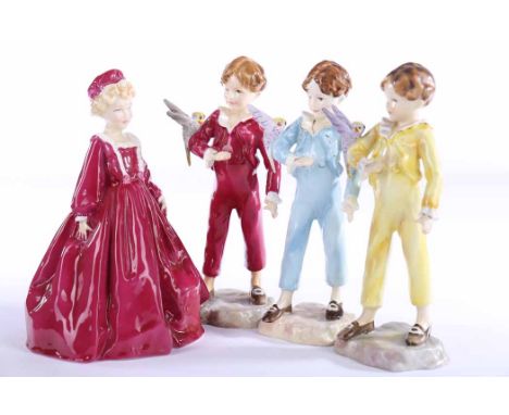 THREE ROYAL WORCESTER FIGURES OF 'THE PARAKEET'
modelled by F. G. Doughty, each boy dressed in blue, yellow and ruby respecti