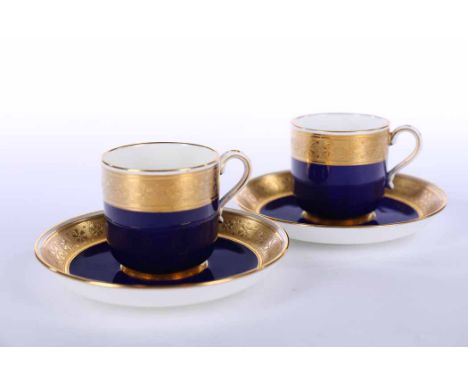 EDWARDIAN MINTONS COFFEE SERVICE
comprising six cans and six saucers, each decorated with heavy gilt band over cobalt blue gr