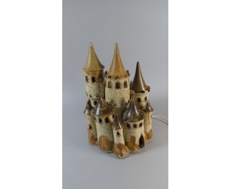 A Glazed Stoneware Novelty Night Light in the Form of a Many Turreted Chateaux, 35cm High
