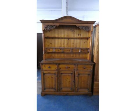 A Pine Dresser with Three Drawers Over Cupboards to Base, Raised Two Shelf Plate Rack with Five Spice Drawers, 133cm Wide 