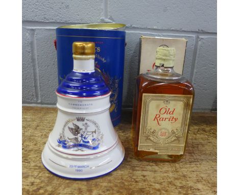 One bottle of Old Rarity De Luxe Scotch Whisky, boxed and a Bell's Old Scotch Whisky decanter, sealed with contents in a cont