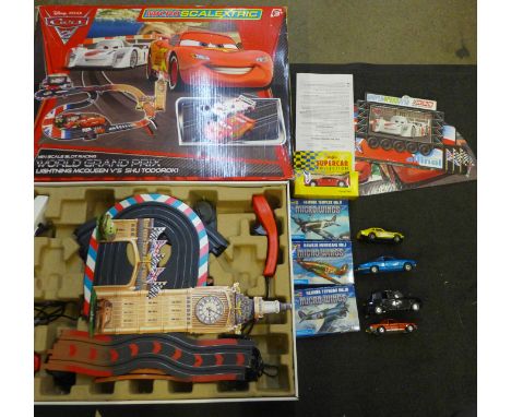 A Pixar Disney Cars Micro-Scalextric set, four die-cast cars, a Maisto car, boxed and three Micro Wings Revell sets 