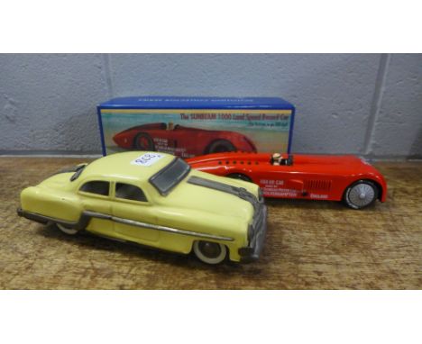 Two tin-plate model vehicles; Schylling The Sunbeam 1000 Land Speed Record car, boxed, and one other (red car 27cm) 