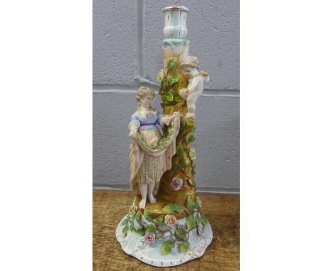 A German porcelain figural candlestick, a/f, 38cm 