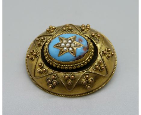 A c1900 oval yellow metal brooch with blue enamel, a/f 