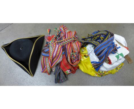 A collection of re-enactment items including Native American sashes (one sash signed Jo. Cartmale) and belts, a hat, two bags