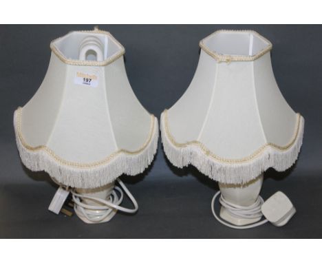 A pair of modern ceramic table lamps with shades 