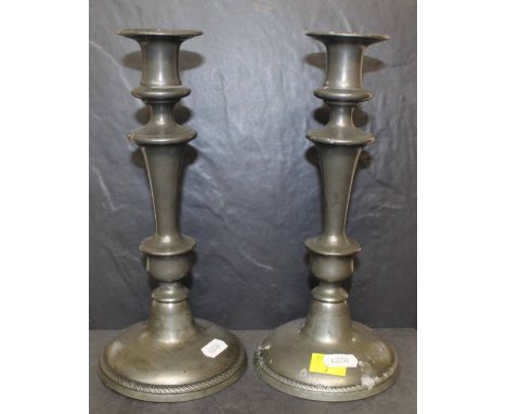 A pair of pewter pillar candlesticks, 25.5 cm high and a small quantity of pewter tankards and measures  