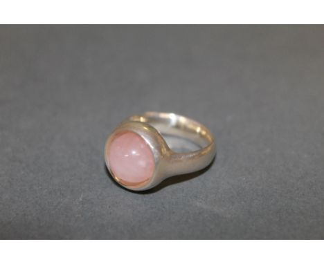 A George Jensen silver and rose quartz set ring with cabochon stone, design No:- 473, ring size J/K, marked 925 S, with Jense