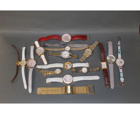 A DKNY gilt metal quartz wrist watch, a Swarovski gilt metal and white bezel wrist watch, a Rotary gilt metal and paste set w
