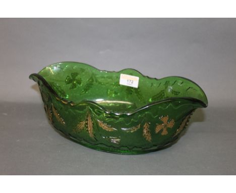 An oval green pressed glass bowl, with gilt enriched decoration, 9 cm x 30 cm x 18 cm (some wear to gilding)