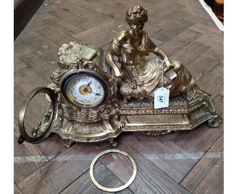 A late 19th/early 20th Century gilded spelter figural mantel clock marked British United Clock Co on movement, 17 1/2" long (