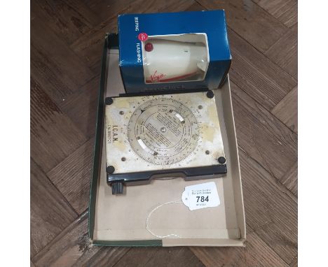 A vintage RAF navigation computer Mk IIIH plus a boxed aero clock in Virgin Atlantic livery