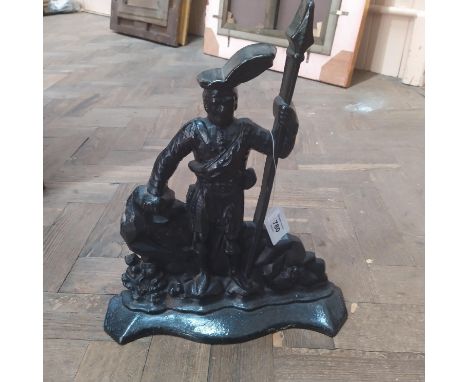 A Victorian black painted cast iron door step, the figure of a Scotsman