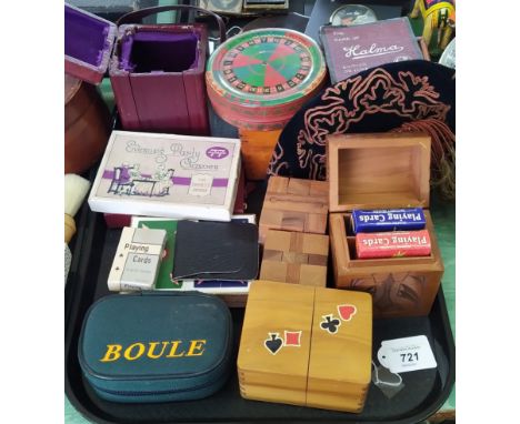 Various playing cards in holders, an empty red leather carriage clock holder plus an assortment of small games