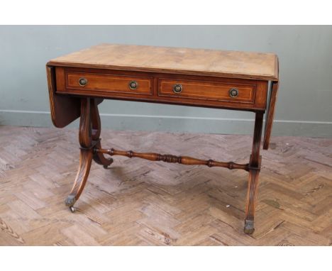 A Regency style satin walnut and mahogany two drawer sofa table, width 38" x depth 24" x height 28"