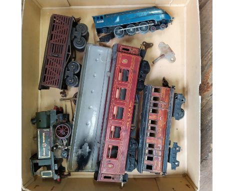 A pre-war train carriage marked Bavaria, a Sir Nigel Gresley engine, a Hornby Great Western Engine and one other all in playw
