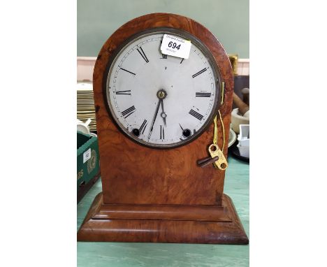 A late 19th Century walnut cased eight day striking mantel clock