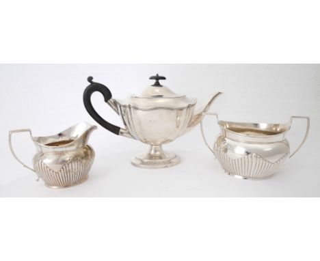 Silver teapot, sugar bowl and milk jug. An Edwardian silver teapot of lobed oval form on oval foot, Sheffield, 1901; together