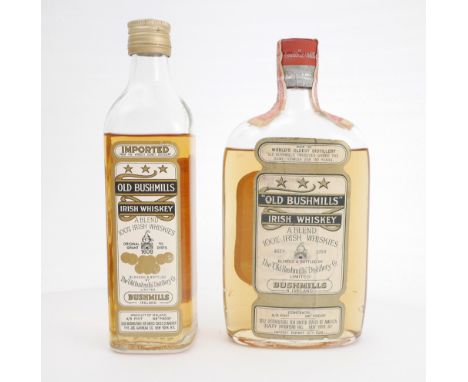 Two 4/5 pint bottles of Old Bushmills Irish Whiskey. A 1930s 4/5 pint bottle of Old Bushmills Irish whiskey, level low should