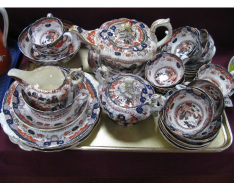 A XIX Century Ironstone Tea Service, comprising teapot, sucrier, jug, slop bowl, large cup and saucer, three sandwich plates 