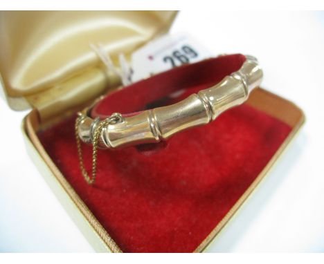 A 9ct Gold Bangle, of bamboo design, hinged to snap clasp.