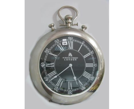 A Large Wall Clock, as a pocket watch.