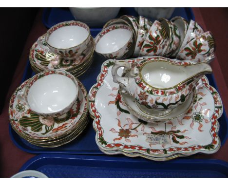 A XIX Century Mason's Tea Service, including two bread and butter plates, milk jug, sugar basin and eleven teacups and saucer