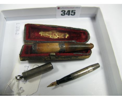 A Miniature Fountain Pen, '14 KT' nib, engine turned case stamped 'STERLING', length 6.4cm, and a cased cheroot holder. (2)