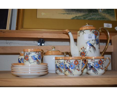 ORIENTAL PORCELAIN TEA SET WITH TEA BOWL AND FIVE CUPS AND SAUCERS