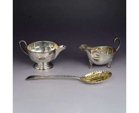 George III silver berry spoon, the oval gilt bowl embossed with fruiting vines and with crimped edge, the handle engraved wit