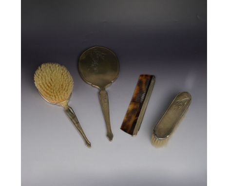 Mid 20th century silver mounted four piece dressing table set, comprising hand mirror, hair brush, clothes brush and comb, al