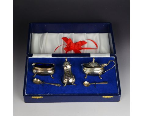Late 20th century silver three piece cruet set, comprising mustard pot, open salt and pepper shaker, with two condiment spoon