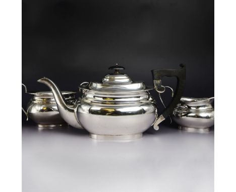 1940s three piece silver tea service, comprising teapot, milk jug and twin handled open sucrier, all of oval bellied form, th