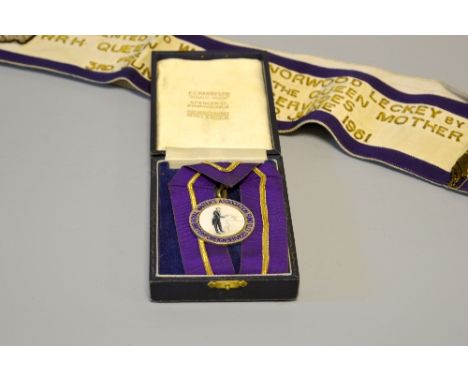 INTERESTING ROYAL MEMORABILIA, with a medal presented to W.H. Leckey by H.R.H. Queen Elizabeth The Queen Mother for The Cater